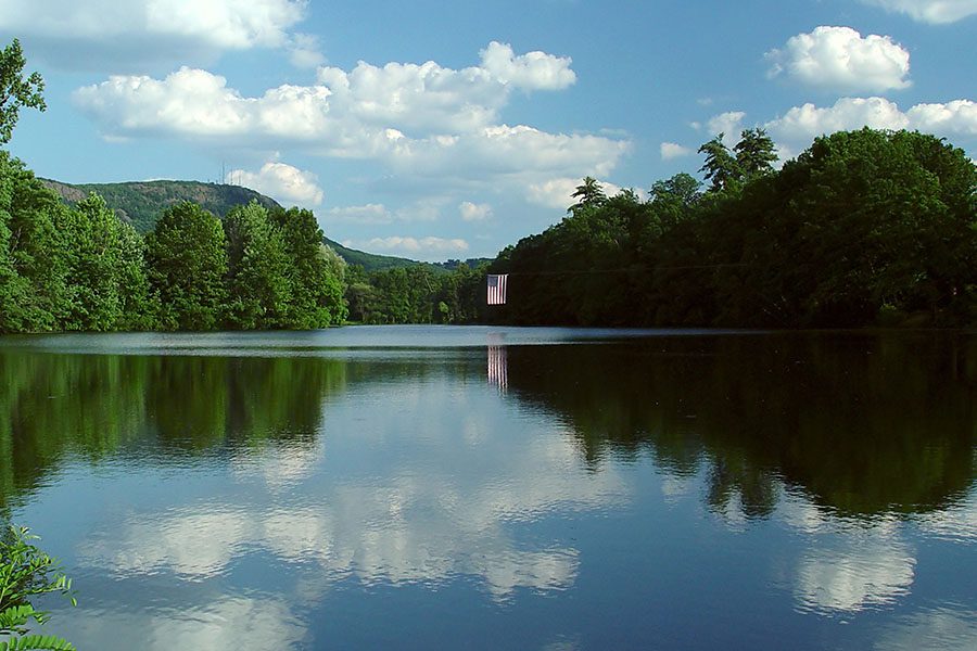 Manchester CT - View of Calm Lake Surrounded by Green Trees in Manchester Connecticut